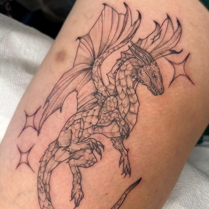 Illustrative Fine line Dragon Tattoo Done By Grace Hanser at Ragtime Tattoo Shop in St. Louis