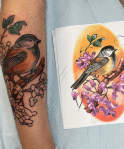 Colorful Bird Tattoo on arm by Matt Hodel