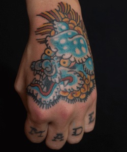 Hand traditional tattoo by Matt Hodel